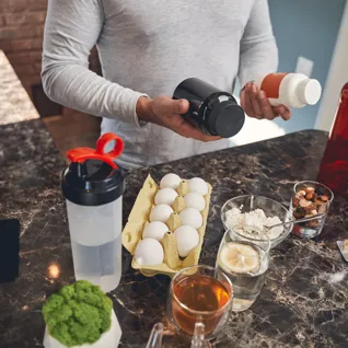 Sportsman With Sports Nutrition At The Table 2021 09 03 15 36 08 Utc